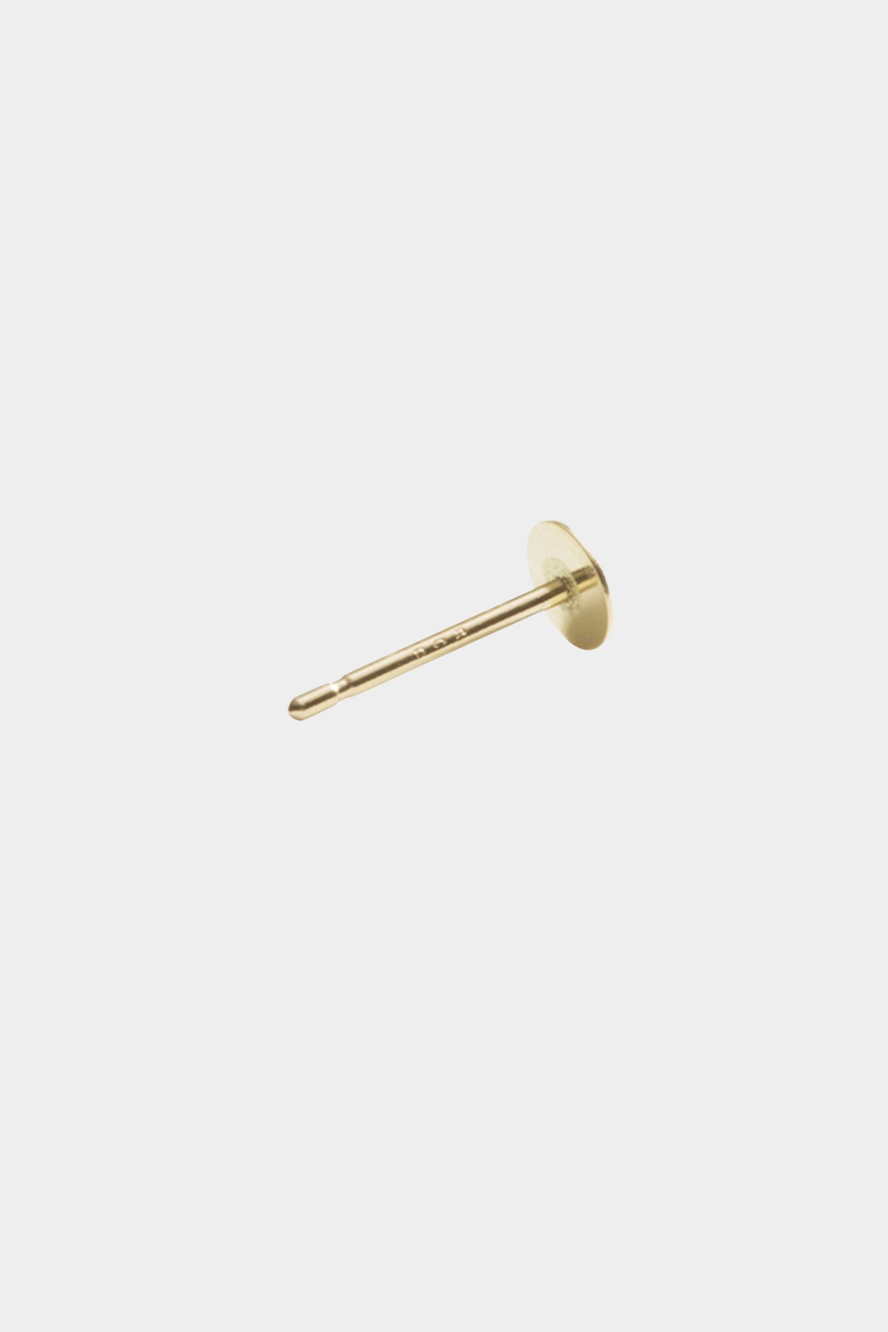 Small gold disc stud earring with flat circular face and post backing.