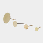 Minimalist gold disc stud earrings in multiple sizes with matte finish.