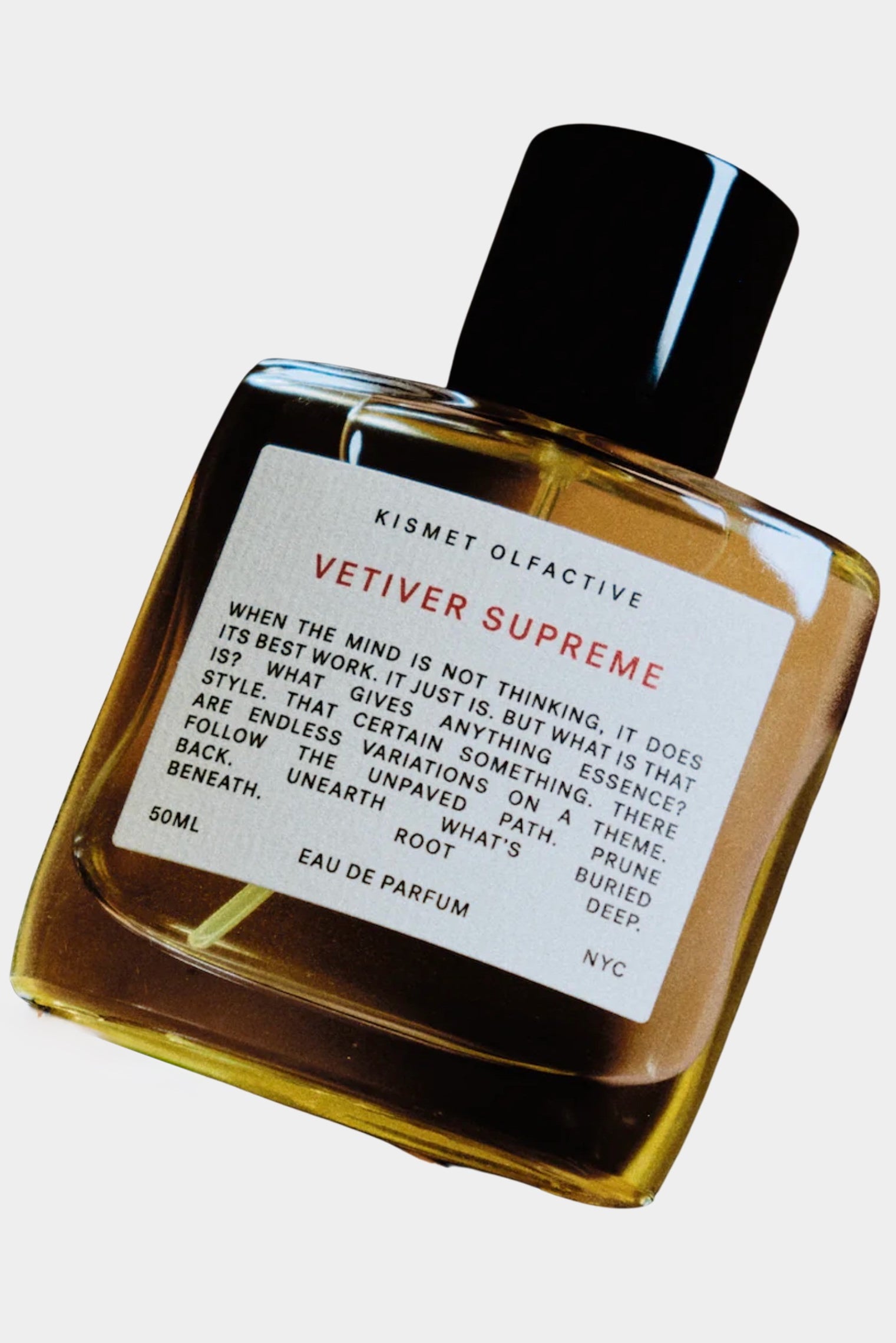 Kismet Olfactive Vetiver Supreme eau de parfum 50ml bottle with black cap, amber liquid, and white label on neutral background