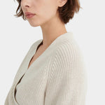 Side close view of the Oatmeal Kowtow Composure Cardigan showing the textured shoulder and wrap edge.