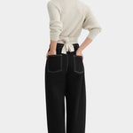 Back view of the Oatmeal Kowtow Composure Cardigan showing its waist ties and textured knit at YUCCA Denver.