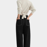 Back view of the Oatmeal Kowtow Composure Cardigan showing its waist ties and textured knit at YUCCA Denver.