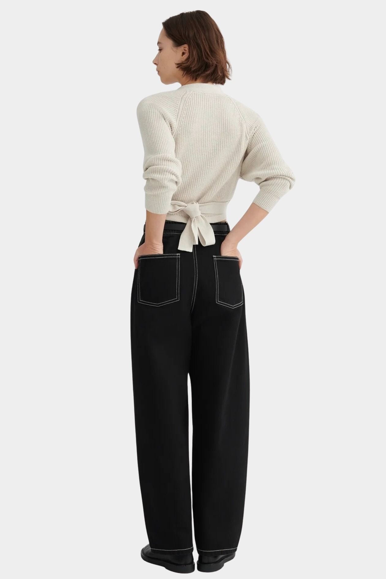 Back view of the Oatmeal Kowtow Composure Cardigan showing its waist ties and textured knit at YUCCA Denver.