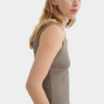 Side view of the Kowtow Everyday Singlet in Flint showing its close fit and finished armhole.