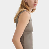 Side view of the Kowtow Everyday Singlet in Flint showing its close fit and finished armhole.