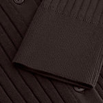 Detail of the Sable Field Cardigan’s rib knit, button and cuff