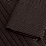 Detail of the Sable Field Cardigan’s rib knit, button and cuff