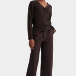 Full front view of the Sable Field Cardigan buttoned with matching brown trousers