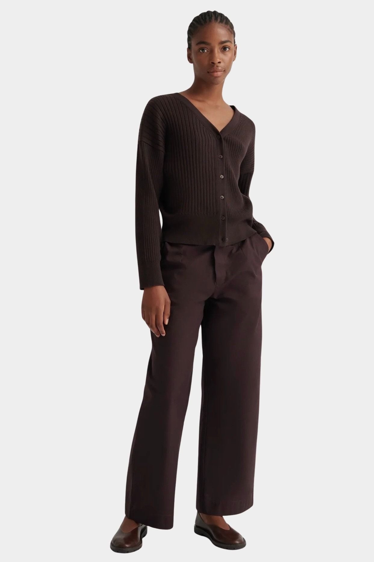 Full front view of the Sable Field Cardigan buttoned with matching brown trousers