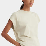 Angled front view of the Stone Kowtow Geometry Tee showing its relaxed shape and extended shoulders