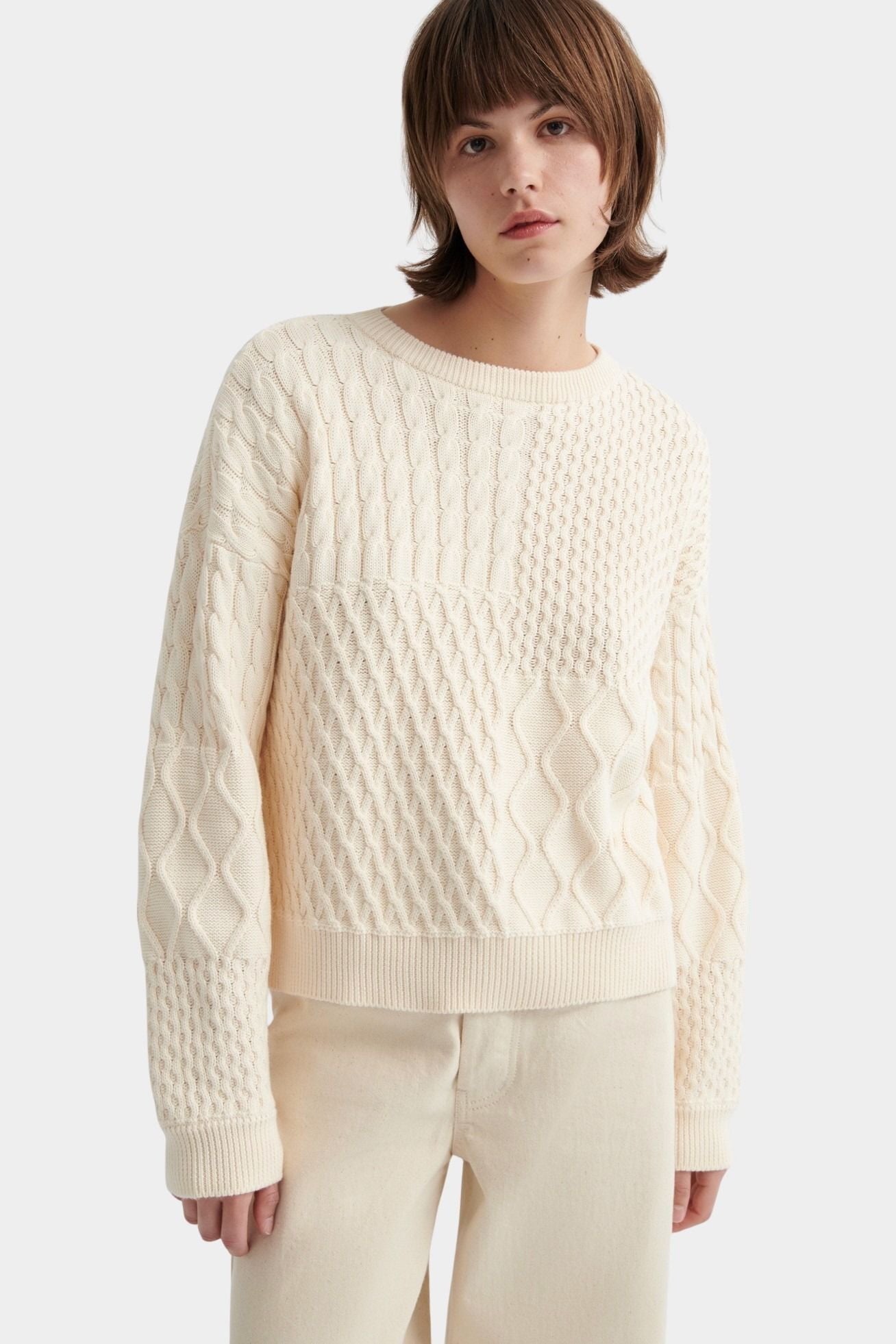 Kowtow chalk organic cotton patchwork jumper close up cable knit detail
