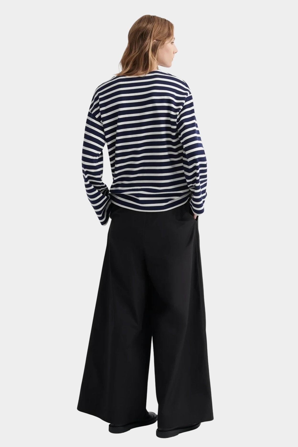 kowtow pierre tee uniform stripe navy ivory striped long sleeve tee back view styled with wide leg trousers