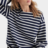 kowtow pierre tee uniform stripe navy and ivory striped organic cotton long sleeve tee close model portrait