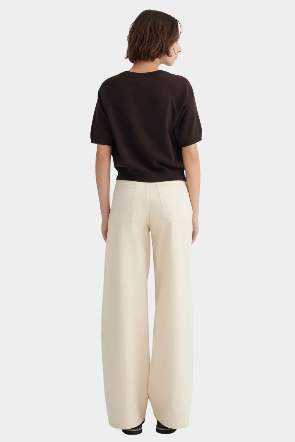 Back view of the Sable Shoreline Tee showing its relaxed shape and ribbed hem