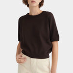 Front view of the Sable Kowtow Shoreline Tee styled with cream trousers at YUCCA Denver