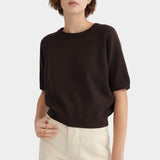 Front view of the Sable Kowtow Shoreline Tee styled with cream trousers at YUCCA Denver