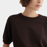 Close view of the Shoreline Tee’s ribbed neckline and raglan seams in Sable