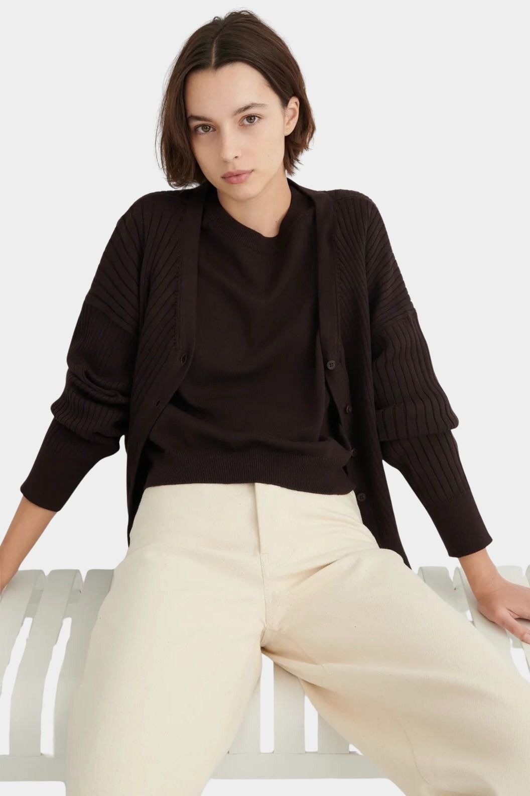 Sable Shoreline Tee layered under a matching ribbed cardigan with cream trousers