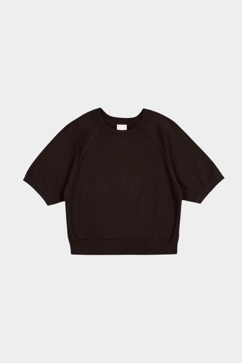 Flat lay of the Sable Kowtow Shoreline Tee showing raglan sleeves and ribbed edges