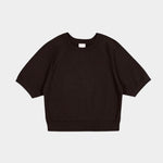 Flat lay of the Sable Kowtow Shoreline Tee showing raglan sleeves and ribbed edges