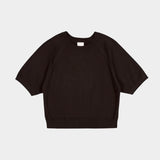 Flat lay of the Sable Kowtow Shoreline Tee showing raglan sleeves and ribbed edges