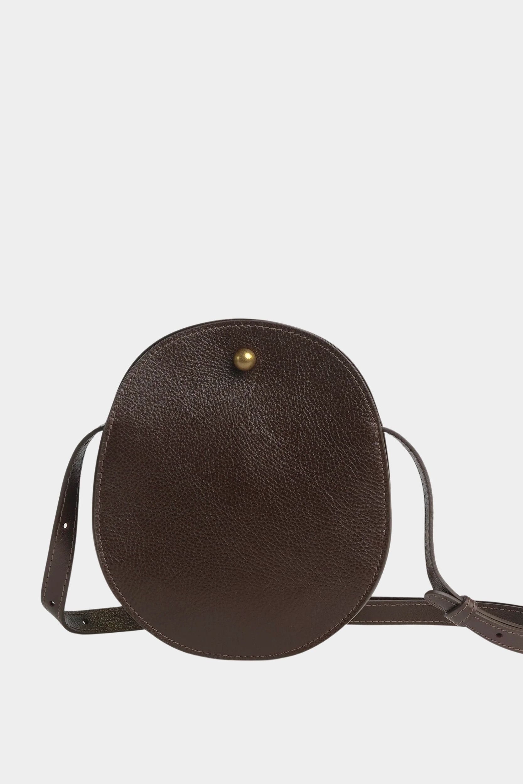 Front view of the LINDQUIST Eggi leather bag in Chaga with an oval silhouette and brass closure, at YUCCA Denver