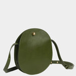 Angled view of the Olive Eggi leather bag showing its side gusset and adjustable shoulder strap