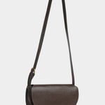 Mezzo leather crossbody bag in Chaga with an extended adjustable strap and brass closure, at YUCCA Denver