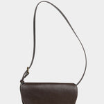 Front view of the LINDQUIST Mezzo bag in Chaga with a curved flap, brass closure, and leather shoulder strap