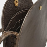 Open LINDQUIST Mini Eggi bag in Chaga showing divided leather compartments, card pockets, and brass snap