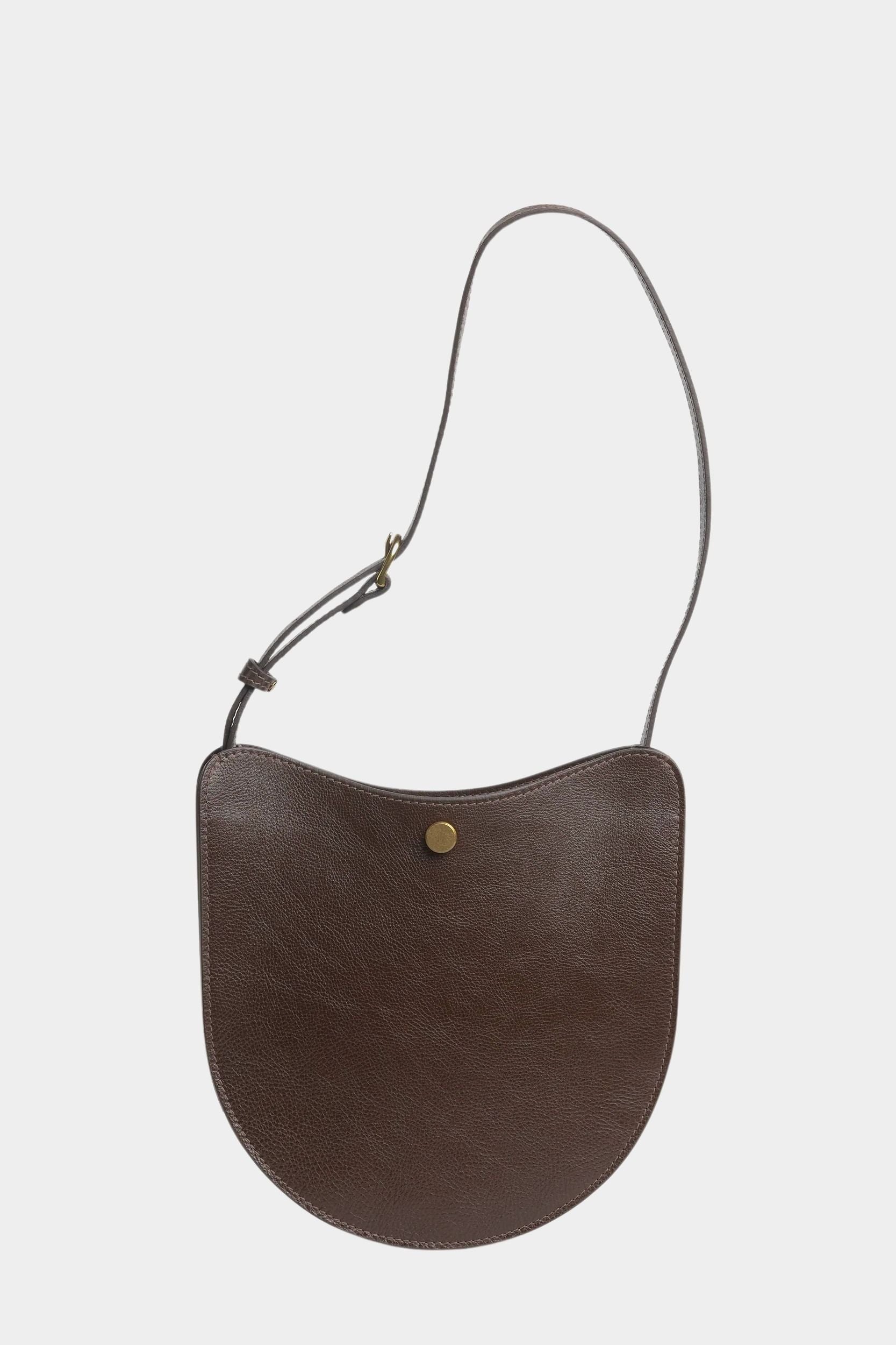 Chaga Savoie leather shoulder bag with a shortened strap and brass adjustment hardware
