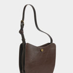Angled view of the LINDQUIST Savoie bag in Chaga showing its rounded front and leather gusset