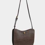 LINDQUIST Savoie bag in Chaga shown with its leather strap extended for crossbody wear