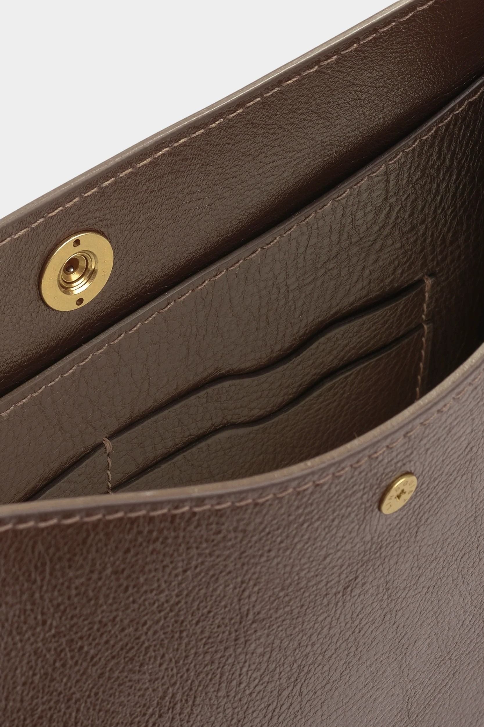 Interior leather card pockets and tonal stitching inside the LINDQUIST Savoie bag in Chaga