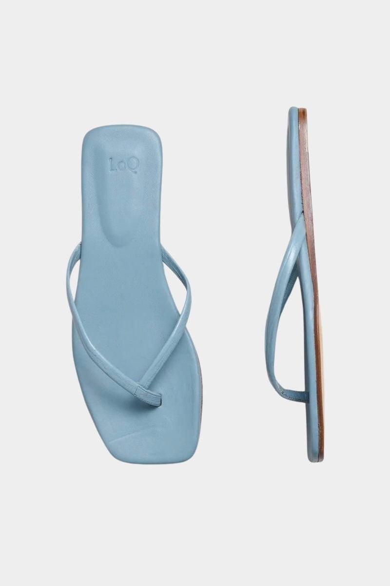 LOQ Salina sandal in ocean blue leather thong sandal angled view showing slim straps and flat sole