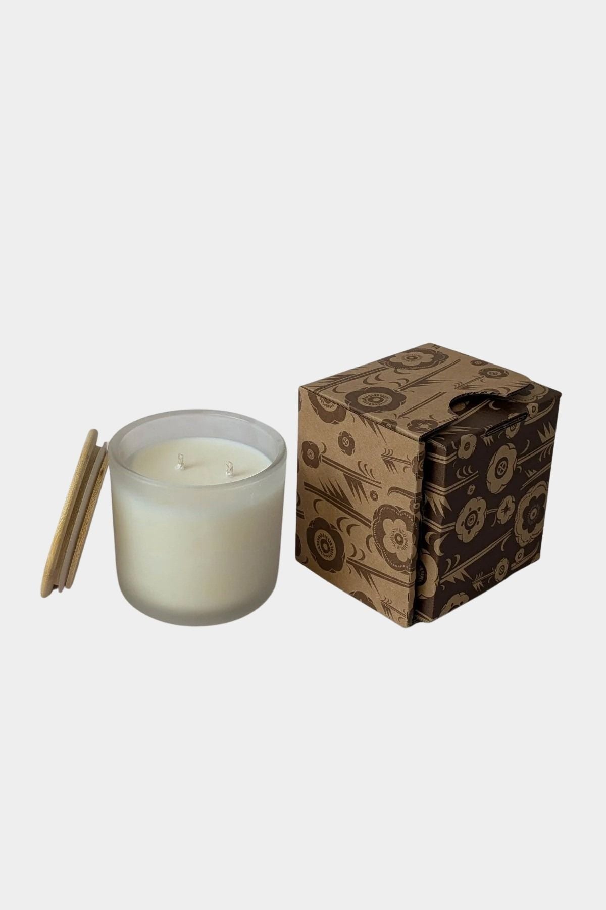 Los Poblanos Vela de la Hacienda Spa Candle with frosted glass vessel, bamboo lid, and floral gift box available at YUCCA Denver boutique in Denver, Colorado