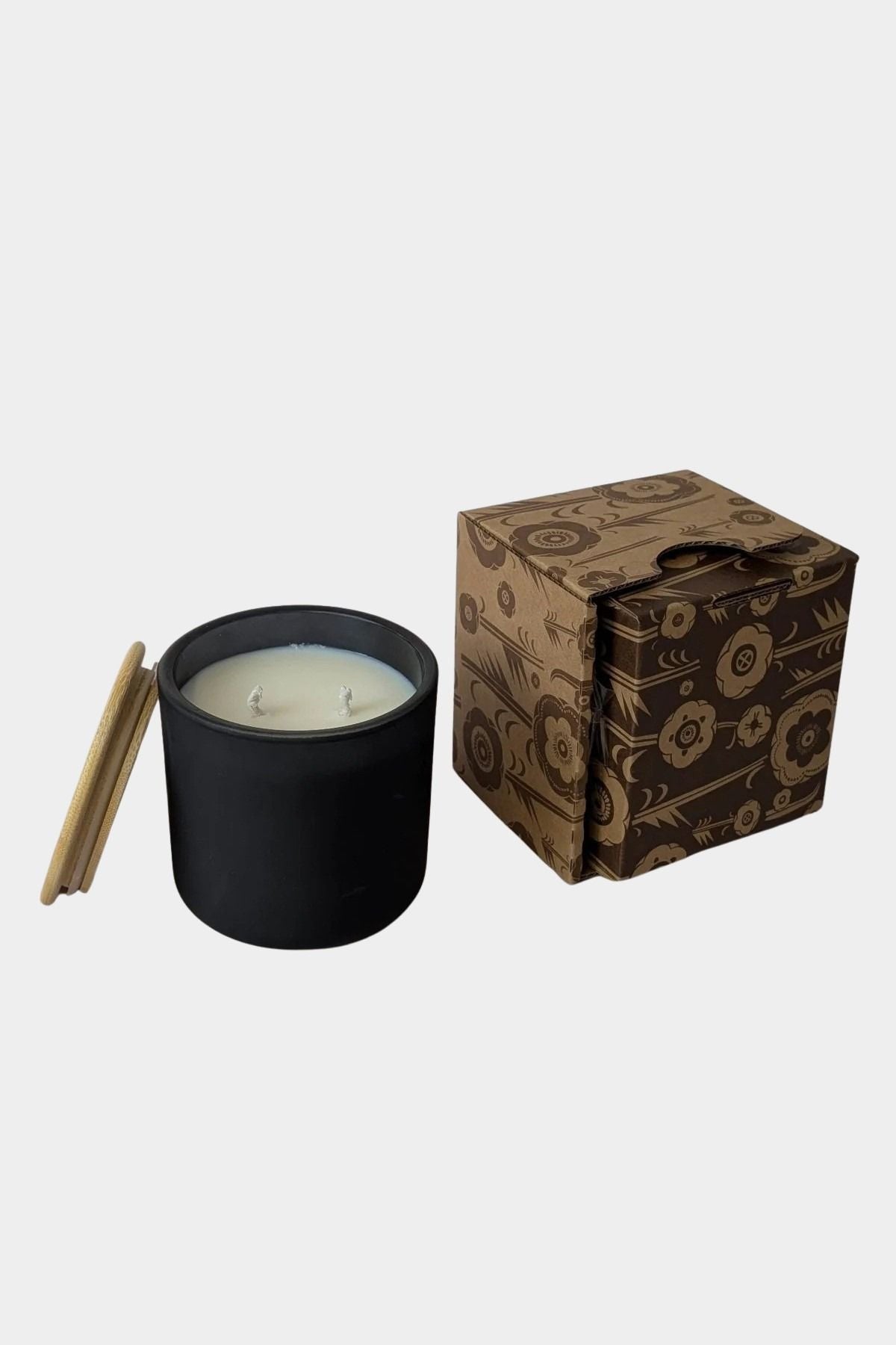 Los Poblanos Vela de la Tierra Candle with matte black vessel, bamboo lid, and floral gift box available at YUCCA Denver boutique in Denver, Colorado