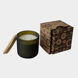 Los Poblanos Vela del Bosque Candle with dark frosted glass vessel, bamboo lid, and floral gift box available at YUCCA Denver boutique in Denver, Colorado