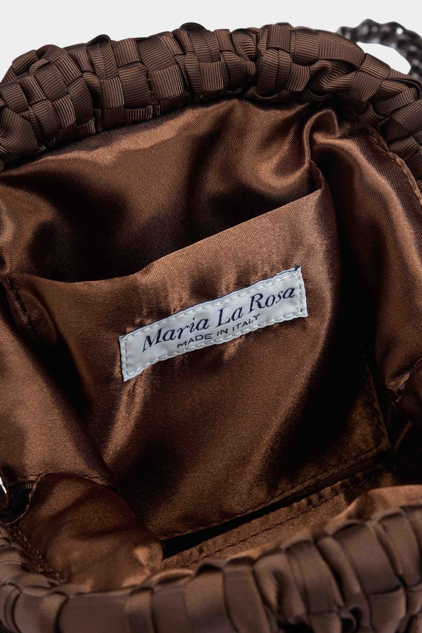 Interior of Maria La Rosa Mini Game Bag in Dark Brown showing satin lining and logo label