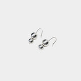 Maslo Jewelry double orb sterling silver drop earrings with polished round beads and sterling silver earwires on light gray background
