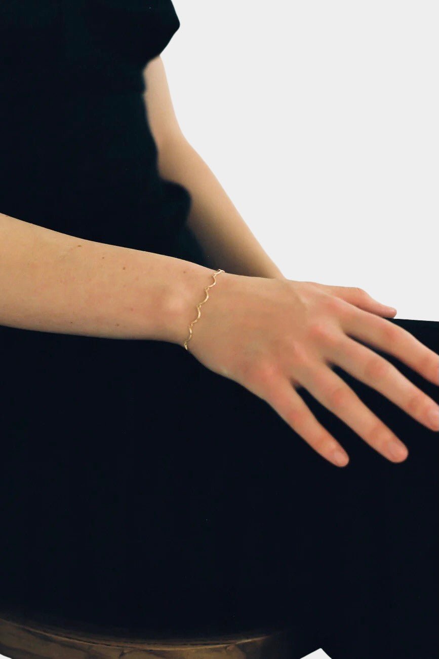 Maslo Jewelry gold filled scallop bracelet worn on wrist