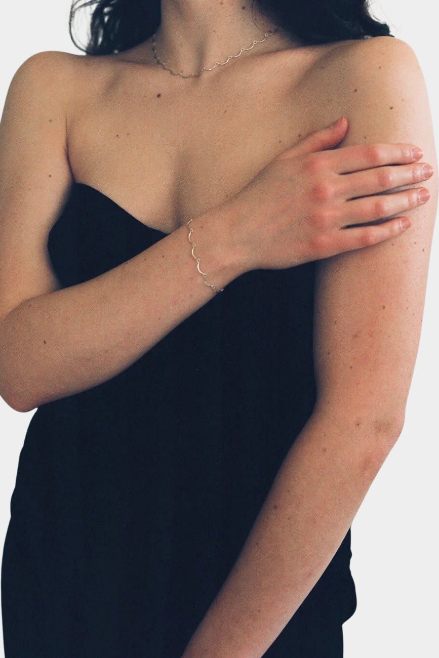 Maslo Jewelry sterling silver scallop bracelet worn on wrist