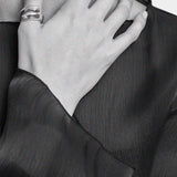 Maslo Jewelry wrap ring in sterling silver worn on hand