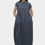 Mijeong Park balloon maxi dress blue gray full length front view relaxed balloon silhouette side pockets