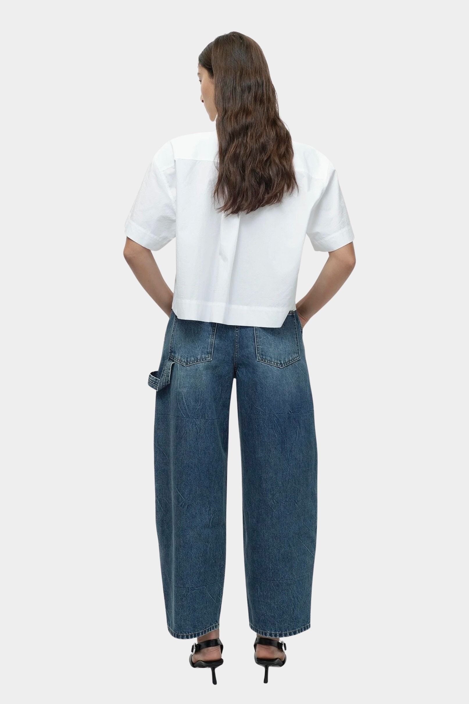 Mijeong Park blue barrel leg patch denim back view relaxed sculpted barrel leg jeans in structured cotton denim