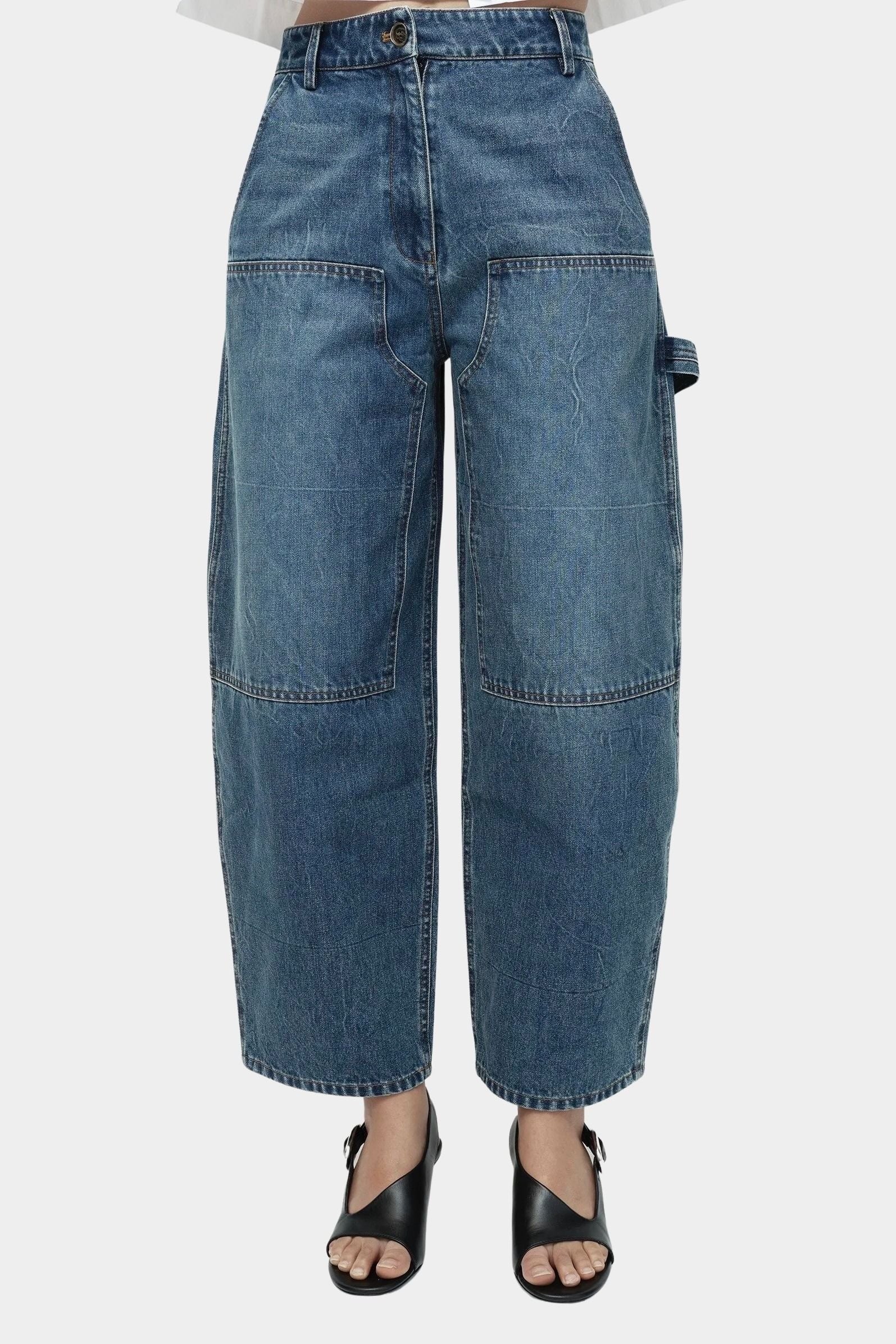 Mijeong Park barrel leg patch denim blue relaxed mid rise barrel leg jeans with front patch pockets modern sculpted denim silhouette
