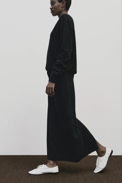 Black cashmere blend knit midi skirt by Mijeong Park