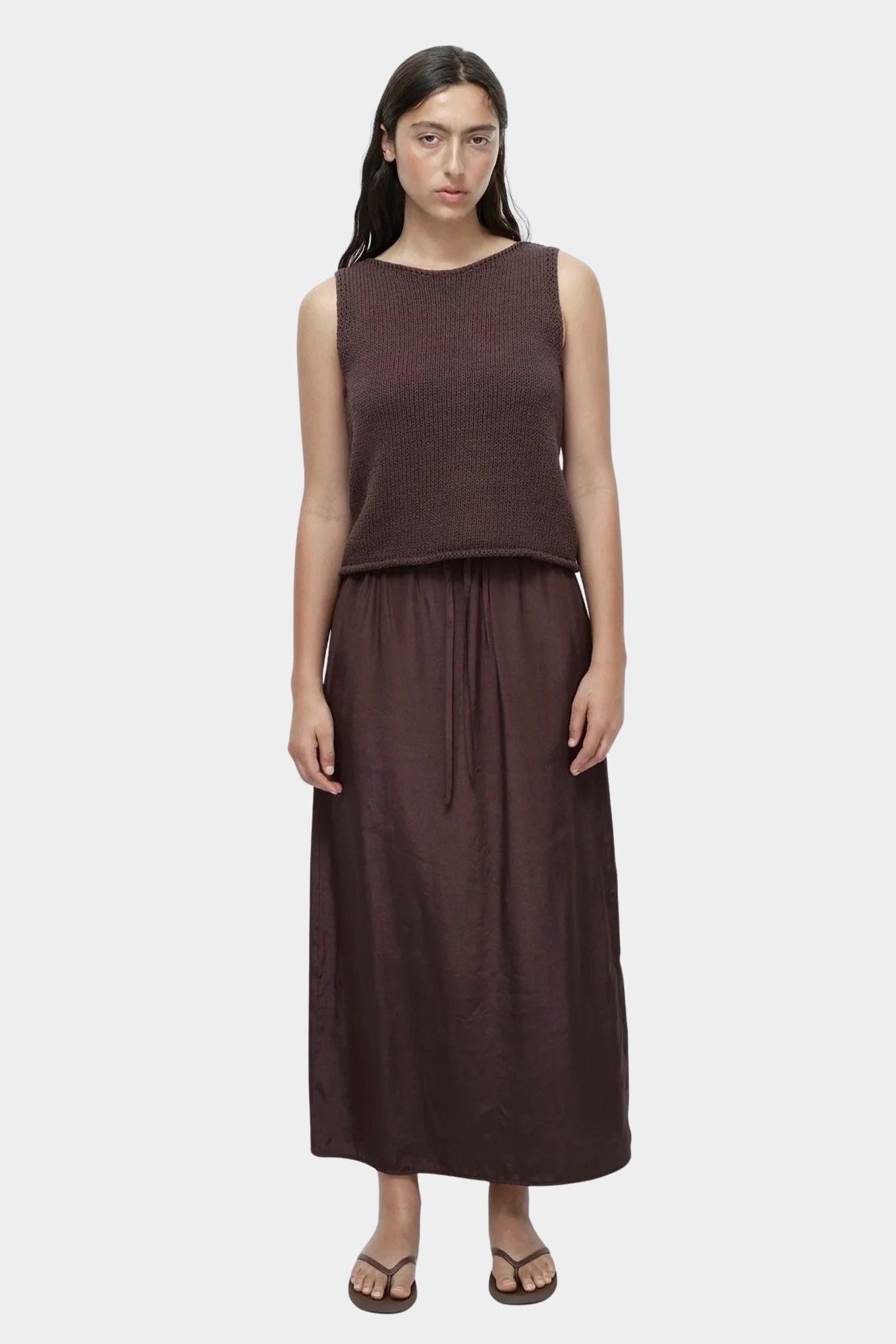 Mijeong Park dark brown drawstring midi skirt lightweight satin relaxed straight fit elastic waist front view