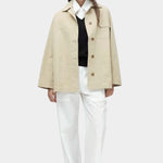 Linen blend work jacket in beige by Mijeong Park with oversized fit, pointed collar, and front button closure