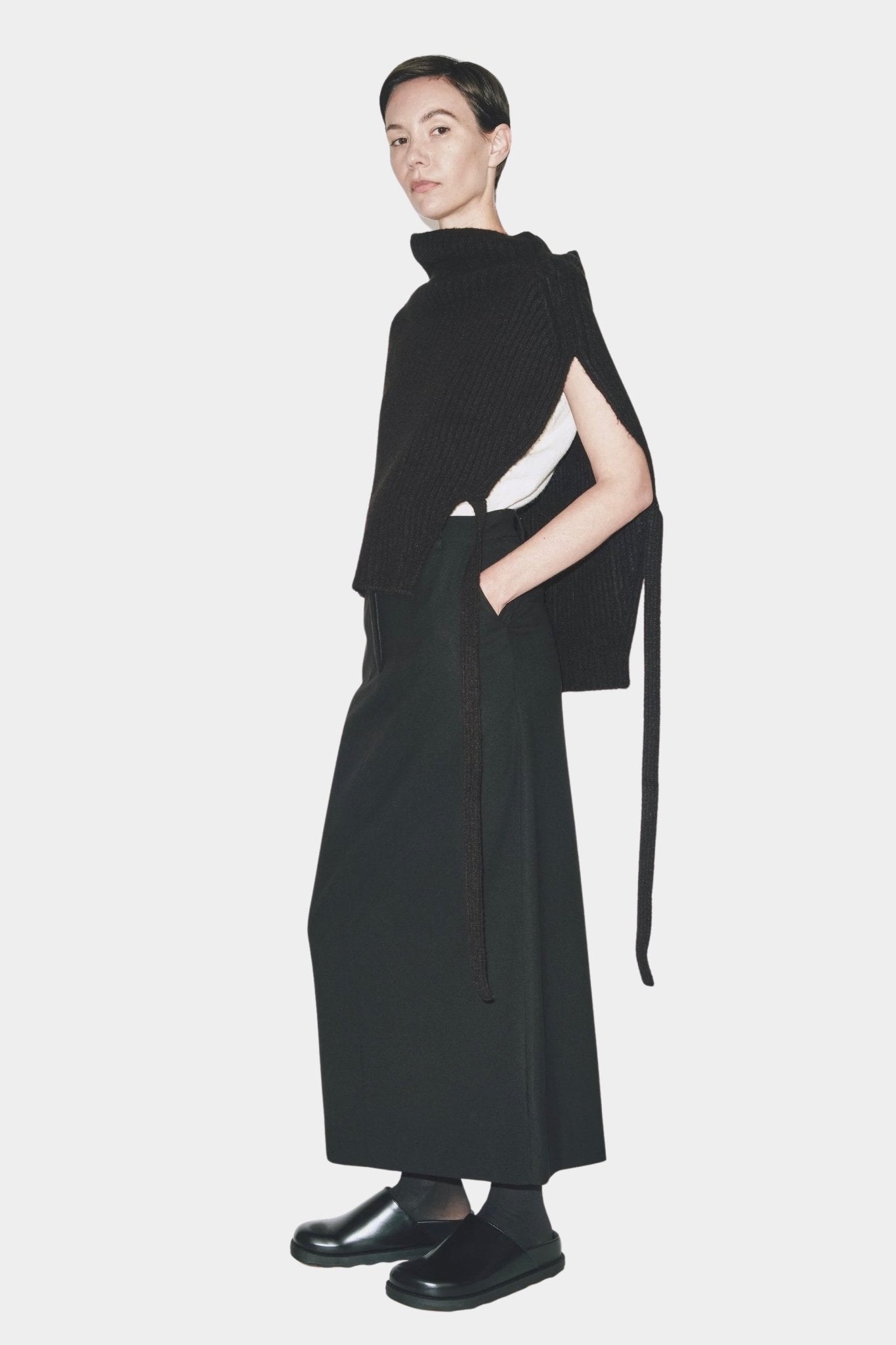 Black ribbed knit neck warmer with open sides by Mijeong Park